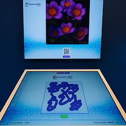 Guest using interactive screen for real-time AI painting at Dubai event, creating digital artwork with immersive technology experience by Mirror Booth Dubai